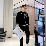 Flat lay presentation of Louis Vuitton luxury clothing with contemporary cut