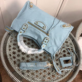 Styled lifestyle shot of statement chic women's handbag – women's statement bag