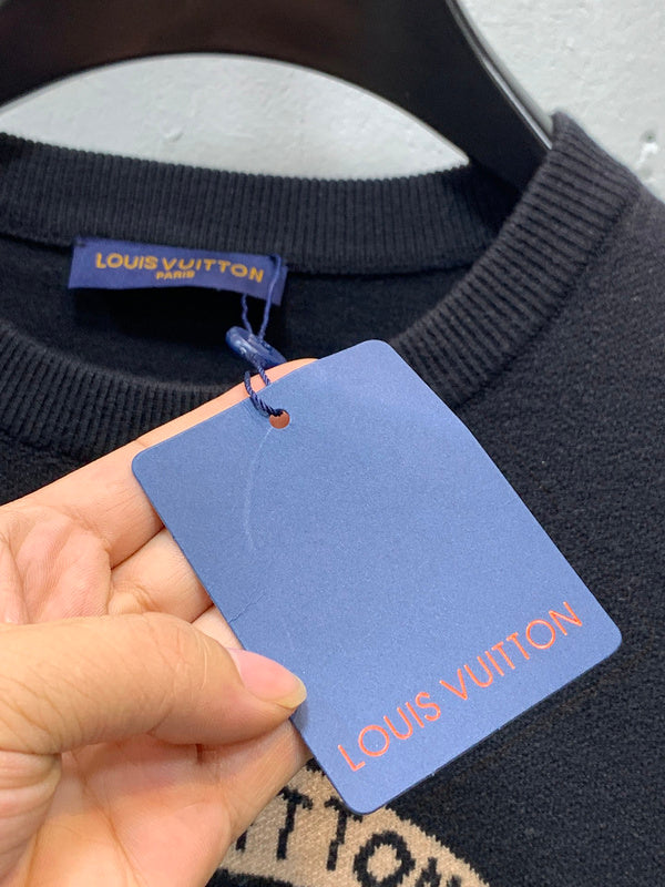 Full styled look of Louis Vuitton luxury clothing with label-forward styling