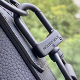 Handle and strap detail of sleek chic women's handbag – women's statement bag