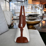  Understated shoulder bag carried on shoulder