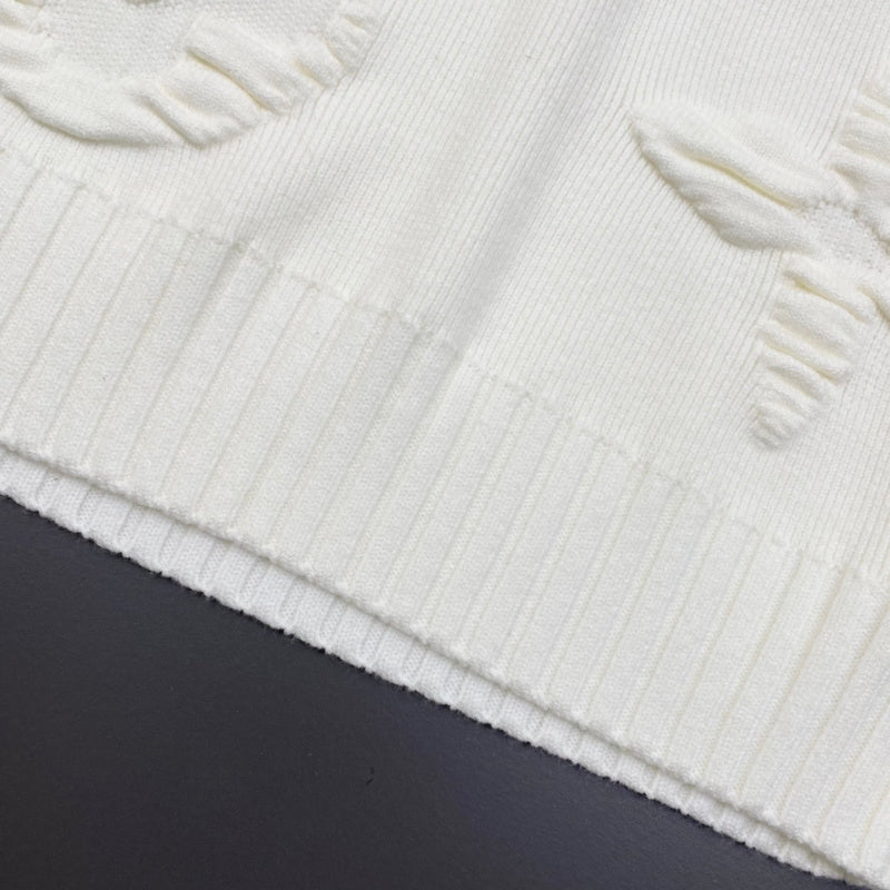 Flat lay presentation of Louis Vuitton luxury clothing with relaxed-fit cut