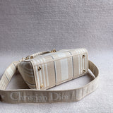 Styled lifestyle shot of polished classic women's handbag – women's luxury accessory