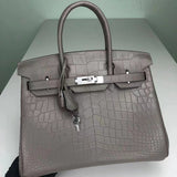 Side view of streamlined structured handbag