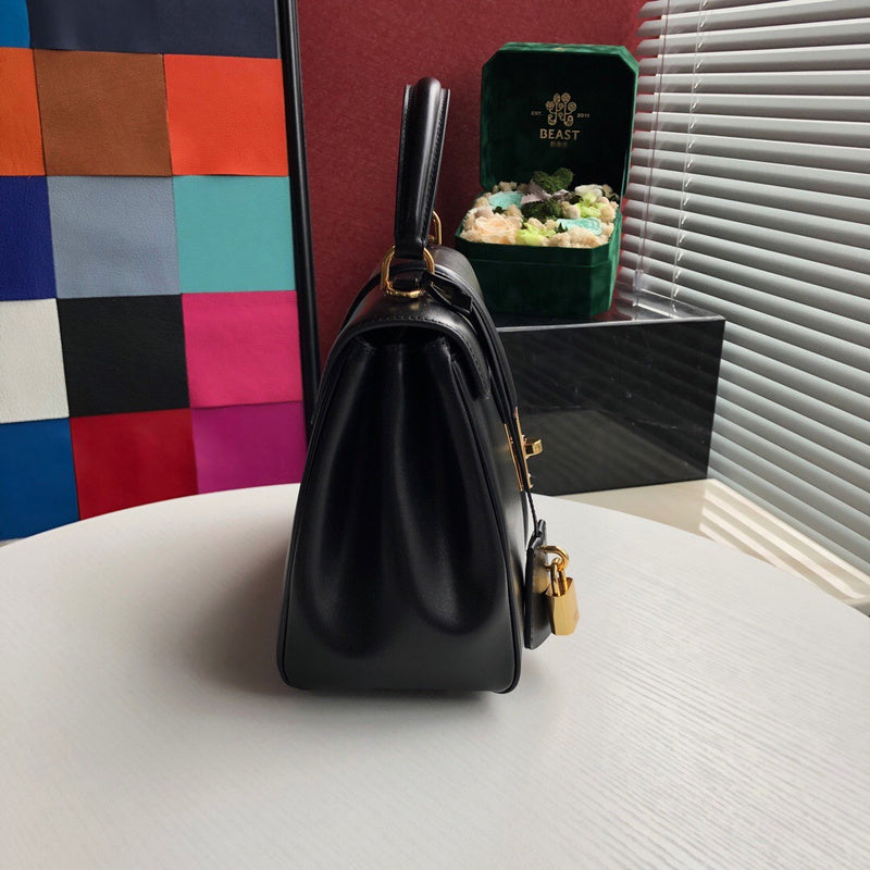 Styled lifestyle shot of modern classic women's handbag – women's designer-style accessory