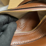 Side profile of refined signature women's handbag – women's designer-style accessory