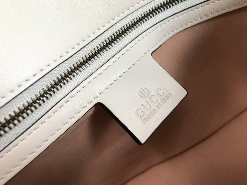 Side profile of everyday-luxe signature women's handbag – women's everyday handbag