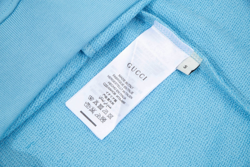 Close-up detail shot of Gucci luxury clothing with contemporary cut