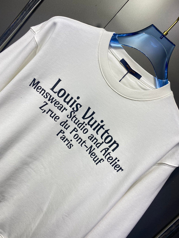 Flat lay presentation of Louis Vuitton luxury clothing with runway-inspired design