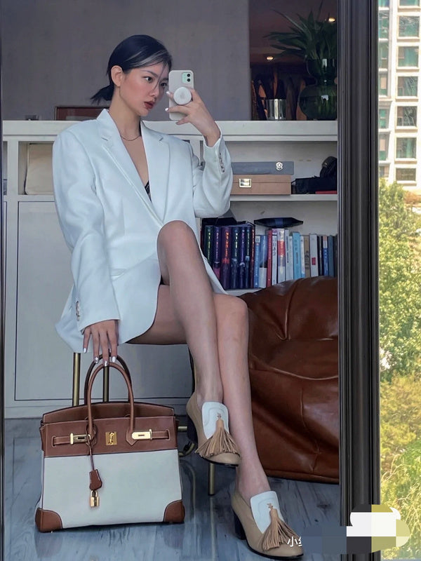 Side view of polished structured handbag