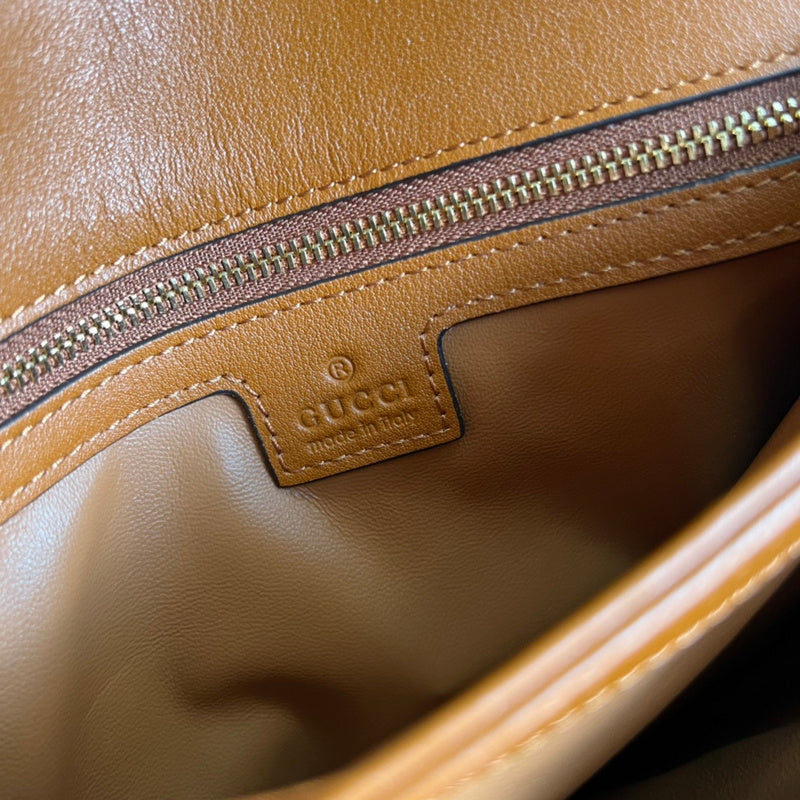 Handle and strap detail of classic refined women's handbag – women's luxury handbag