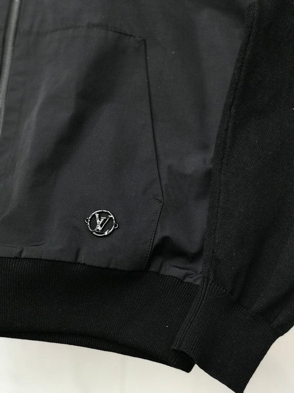 Close-up detail shot of Louis Vuitton luxury clothing with signature branding