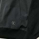 Close-up detail shot of Louis Vuitton luxury clothing with signature branding