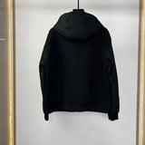 Close-up detail shot of Louis Vuitton luxury clothing with label-forward styling