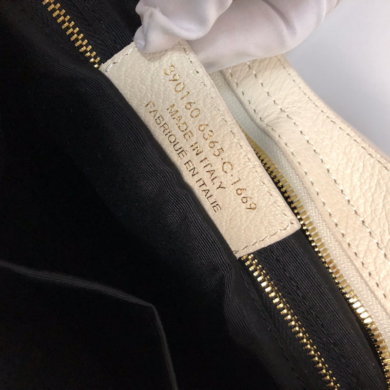 Close-up detail of polished premium women's handbag – women's statement bag