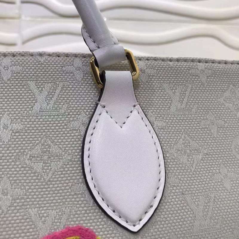Handle and strap detail of everyday-luxe sleek women's handbag – women's designer-style accessory