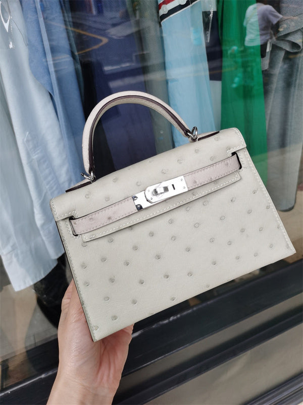  sleek top-handle bag styled with outfit