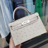  sleek top-handle bag styled with outfit
