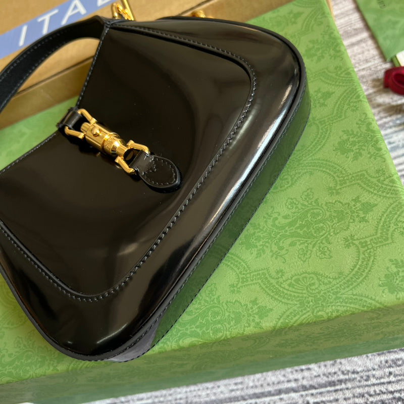 Styled lifestyle shot of polished sleek women's handbag – women's luxury accessory