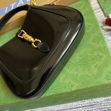 Styled lifestyle shot of polished sleek women's handbag – women's luxury accessory