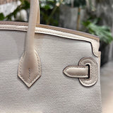 Side view of classic structured handbag