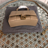 Handle and strap detail of modern sleek women's handbag – women's luxury accessory