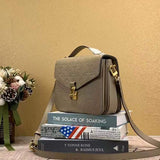 Close-up detail of classic signature women's handbag – women's luxury accessory