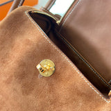 Side view of poised structured handbag