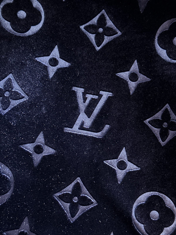 Flat lay presentation of Louis Vuitton luxury clothing with streetwear-inspired cut