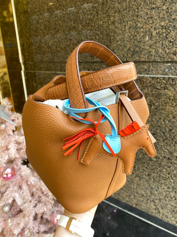 Side view of understated structured handbag