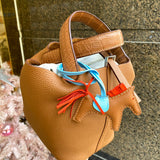 Side view of understated structured handbag