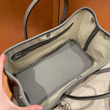 Side view of sophisticated structured handbag