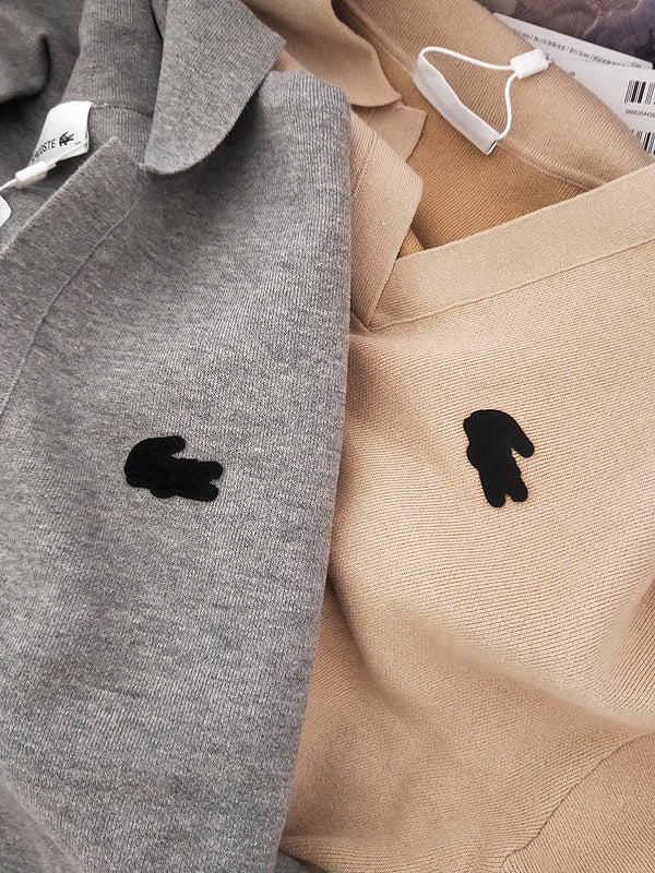 Side profile of Lacoste luxury clothing with monogram-inspired silhouette