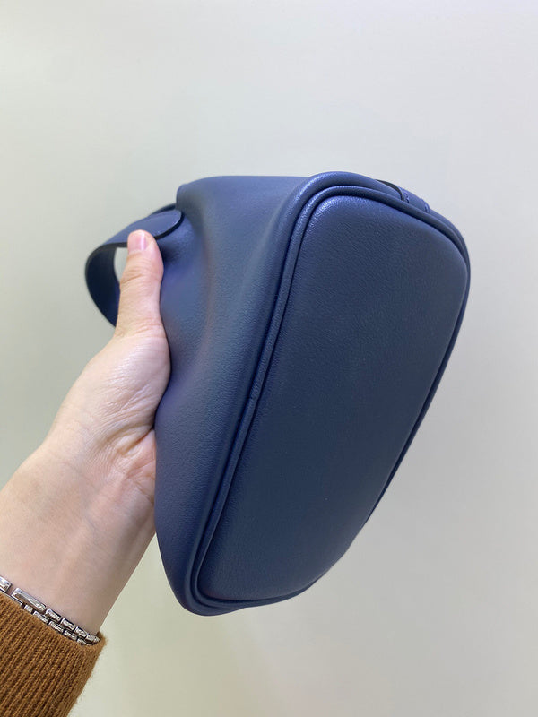Side view of understated structured handbag