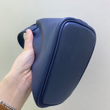 Side view of understated structured handbag