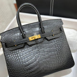 Side view of classic structured handbag
