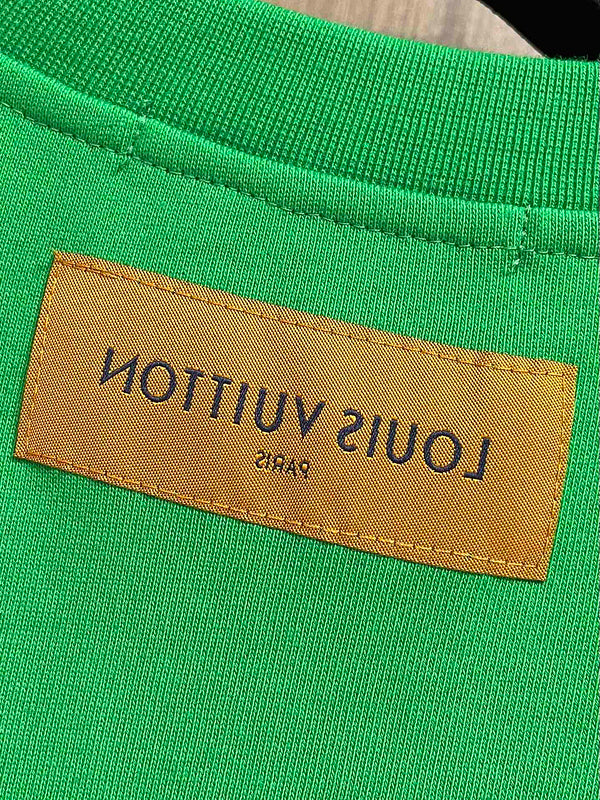 Side profile of Louis Vuitton luxury clothing with tailored silhouette