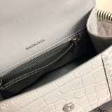 Front view of sleek classic women's handbag – women's designer-style accessory