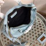 Close-up detail of statement chic women's handbag – women's statement bag