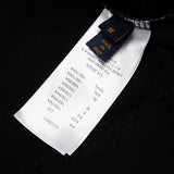 Front view of Louis Vuitton luxury clothing with signature branding