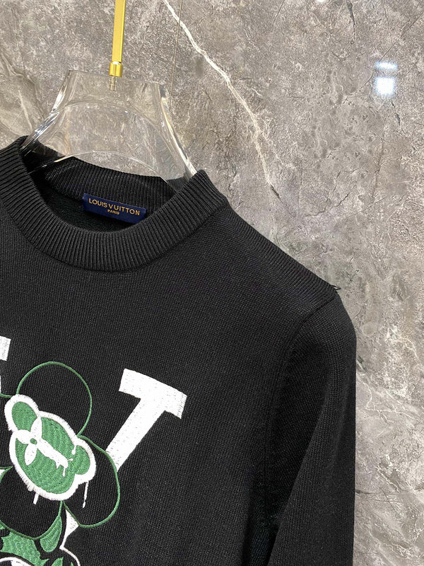 Close-up detail shot of Louis Vuitton luxury clothing with label-forward styling