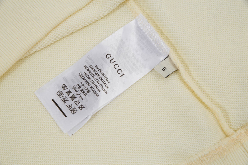 Close-up detail shot of Gucci luxury clothing with relaxed-fit cut