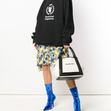 Close-up of Balenciaga totes hardware and fine stitching