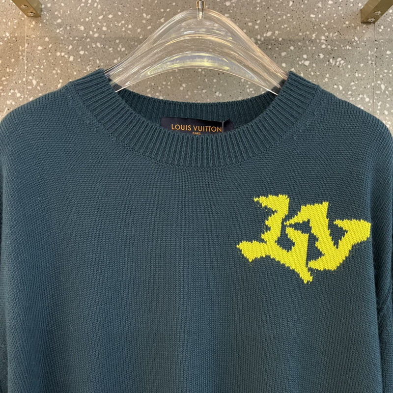 Flat lay presentation of Louis Vuitton luxury clothing with label-forward styling