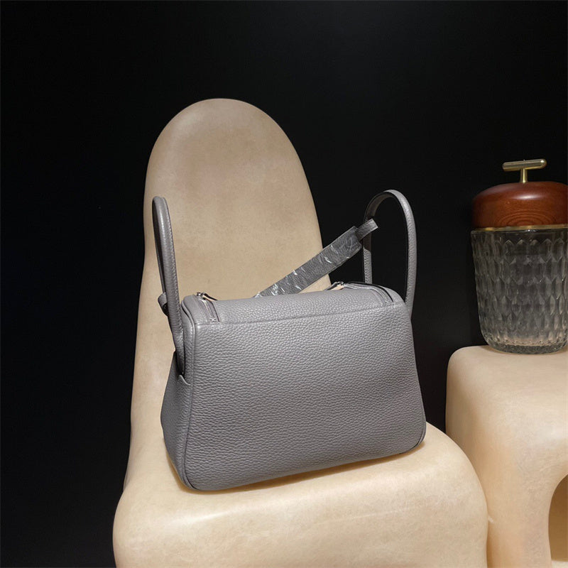 Side view of tailored structured handbag