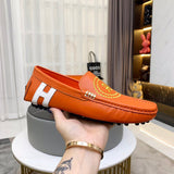 Hermès Burgundy Slip-On Sneakers - Close-Up Texture View