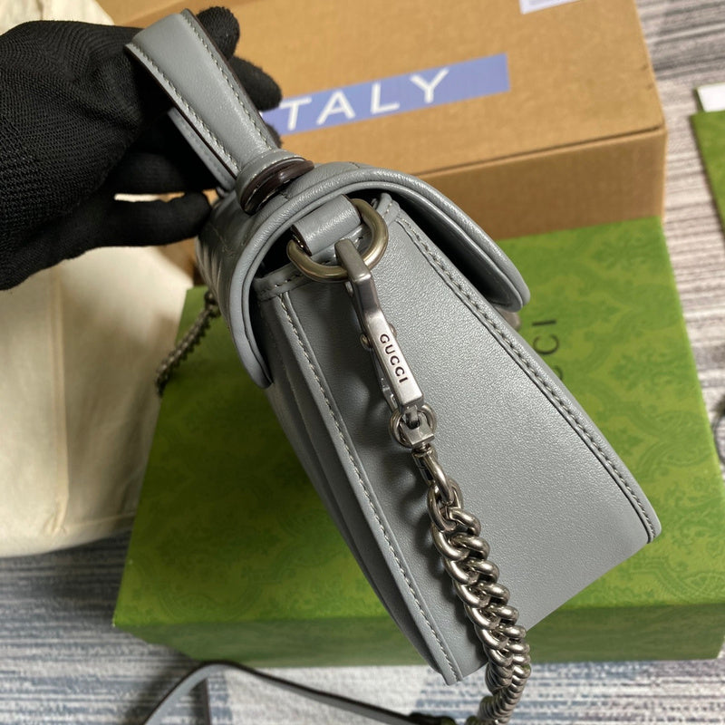 Front view of statement polished women's handbag – women's luxury accessory