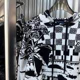 Close-up detail shot of Louis Vuitton luxury clothing with everyday silhouette