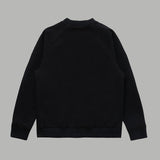 Side profile of Louis Vuitton luxury clothing with signature branding
