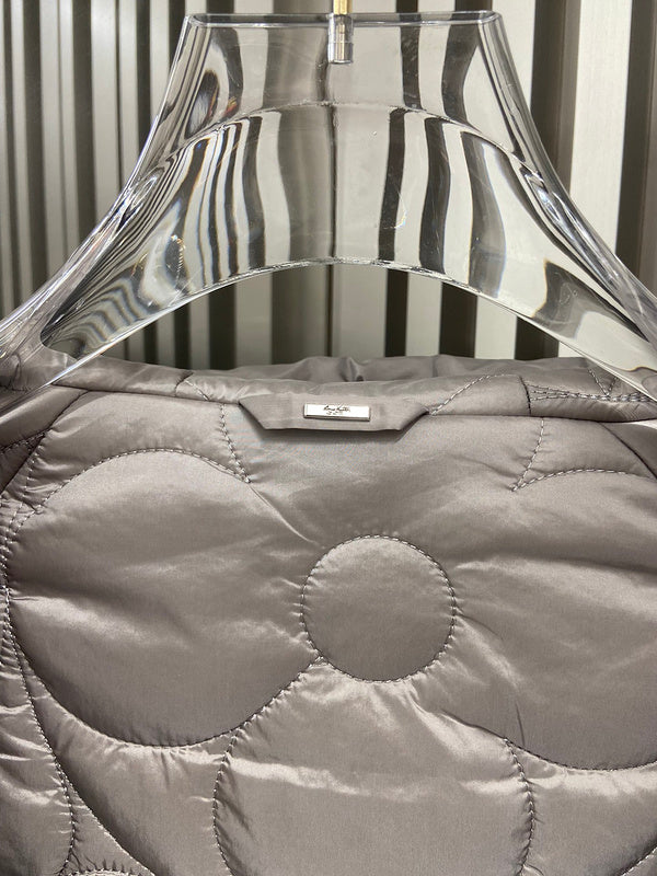 Close-up detail shot of Louis Vuitton luxury clothing with logo-detail design